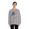 Sport grey crewneck sweatshirt with front cartoon graphic; worn by a female model