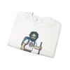 White crewneck sweatshirt folded, featuring bearded hiker graphic on chest