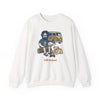 White crewneck sweatshirt on model with camping scene graphic and text on chest.