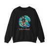 Black crewneck sweatshirt with surfer character graphic and 'Life is dead.' text