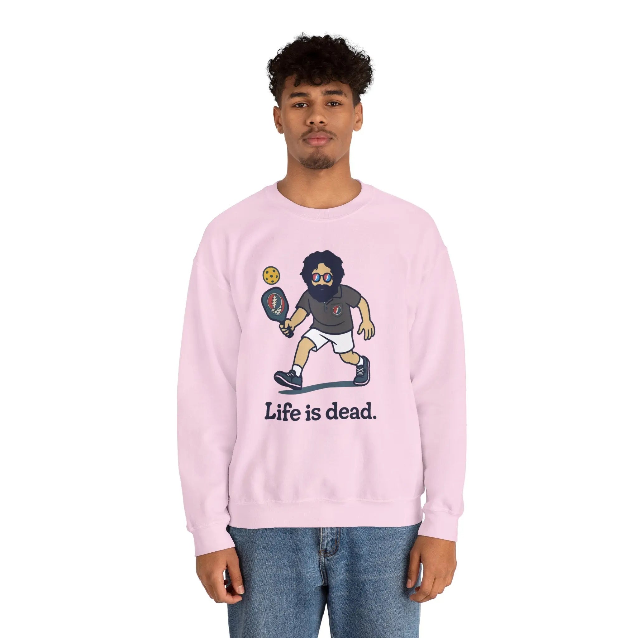 Light pink crewneck sweatshirt with cartoon character graphic and 'Life is dead,' modeled