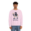 Light pink crewneck sweatshirt with cartoon character graphic and 'Life is dead,' modeled