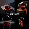 Crystal wine glass with red wine, rotating mechanism on round wooden coaster