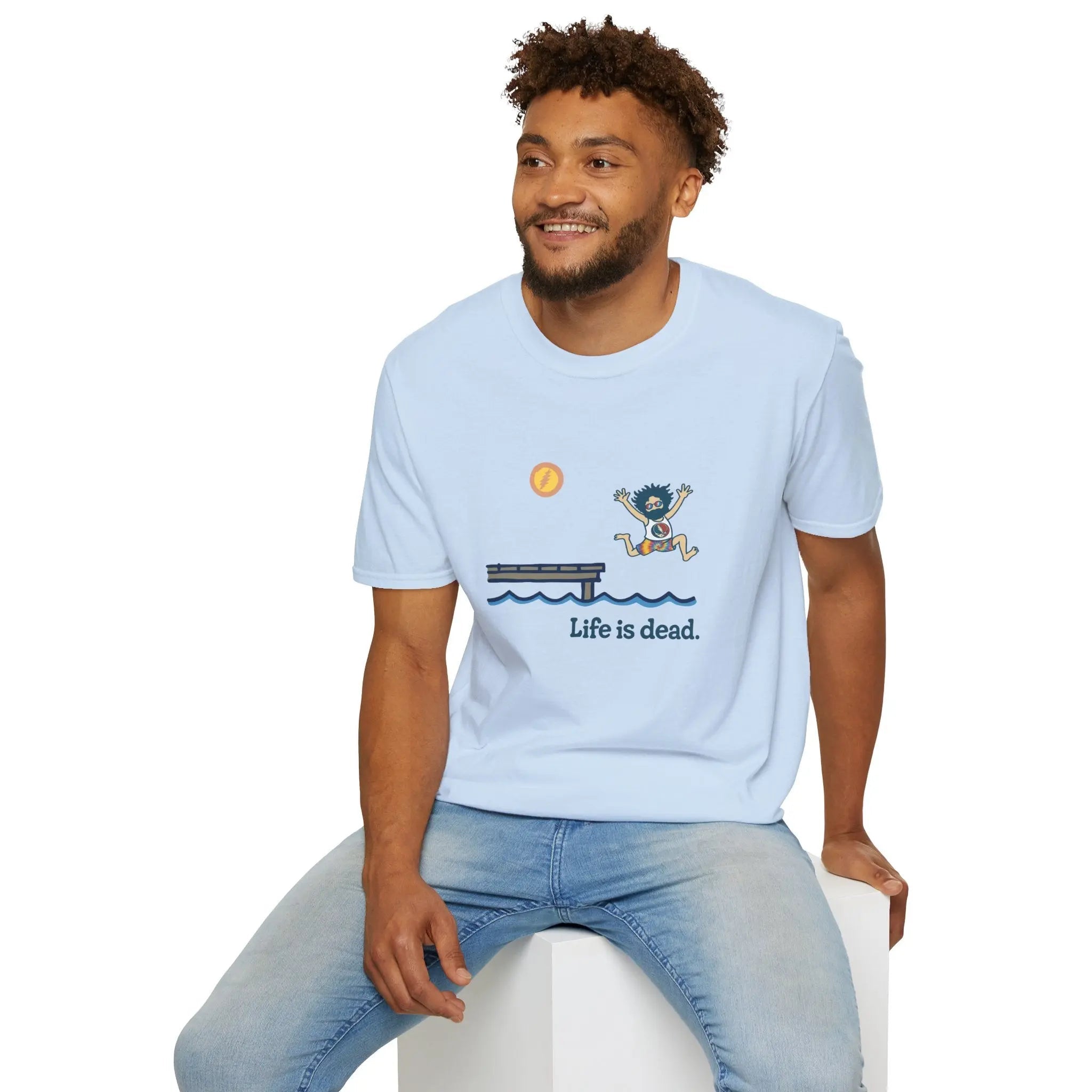 Light blue crewneck T-shirt with blue lake scene, cartoon figure, and 