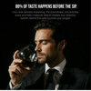Man sipping from a crystal wine glass with red wine