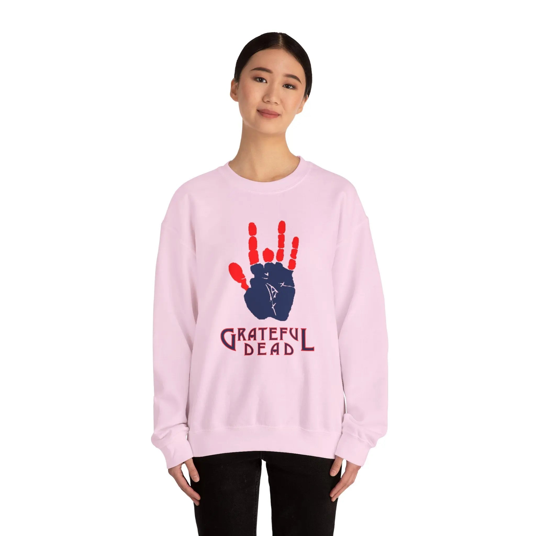 Light pink crewneck sweatshirt with red handprint and “Grateful Dead” text on chest
