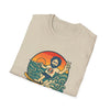 Beige T-shirt with front graphic of a bearded man in a circular orange scene
