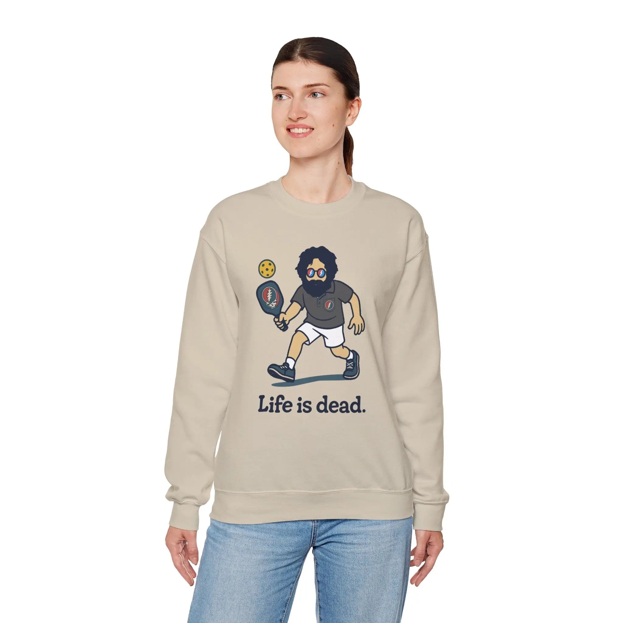 Sand crewneck sweatshirt featuring a cartoon character holding a pickled item