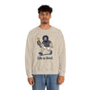 Sand-colored crewneck sweatshirt with front graphic and “Life is dead.” text