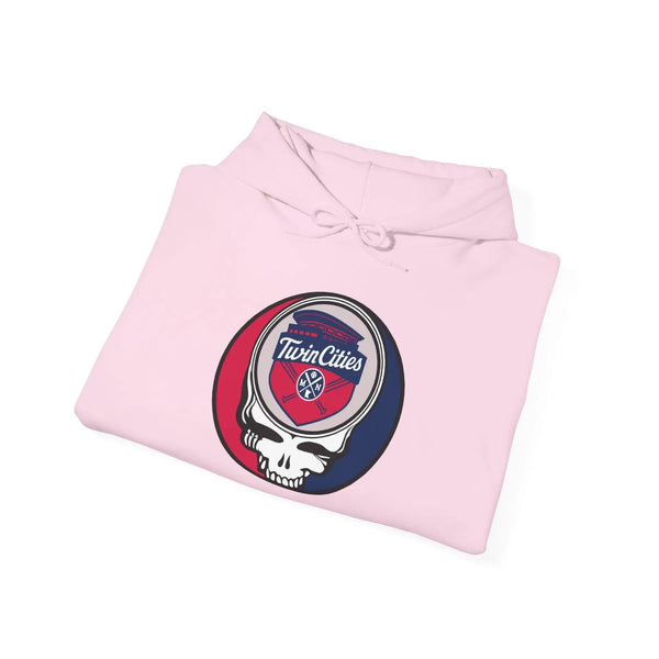 Light pink pullover hoodie folded with Twin Cities logo patch at center