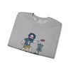 Light gray folded sweatshirt with cartoon disc-golf graphic print