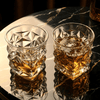 Two crystal whisky tumblers with faceted star-cut sides