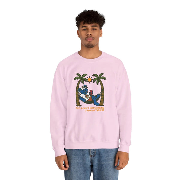 Light pink crewneck sweatshirt on model, front bear graphic with palms