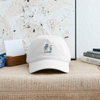 White dad hat with embroidered golfer logo and curved brim.