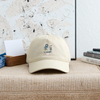 Khaki dad hat with front embroidered logo, curved brim and stitched eyelets.