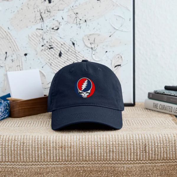 Navy dad hat with front lightning skull patch logo and stitched ventilation eyelets