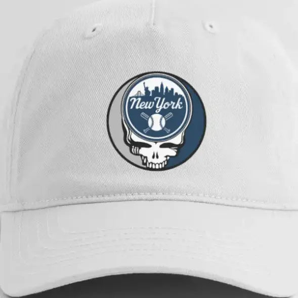 White dad hat with round New York Yankees logo patch on the front.