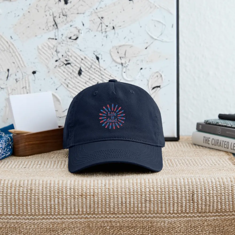 Navy dad hat with Life is Dead rainbow sunburst logo on front