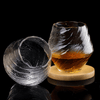Two faceted crystal whisky glasses with amber liquid, clear smoky glass look