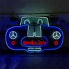 Neon car sign showing blue outline, red side lights, SHELBY, and Mercedes logos