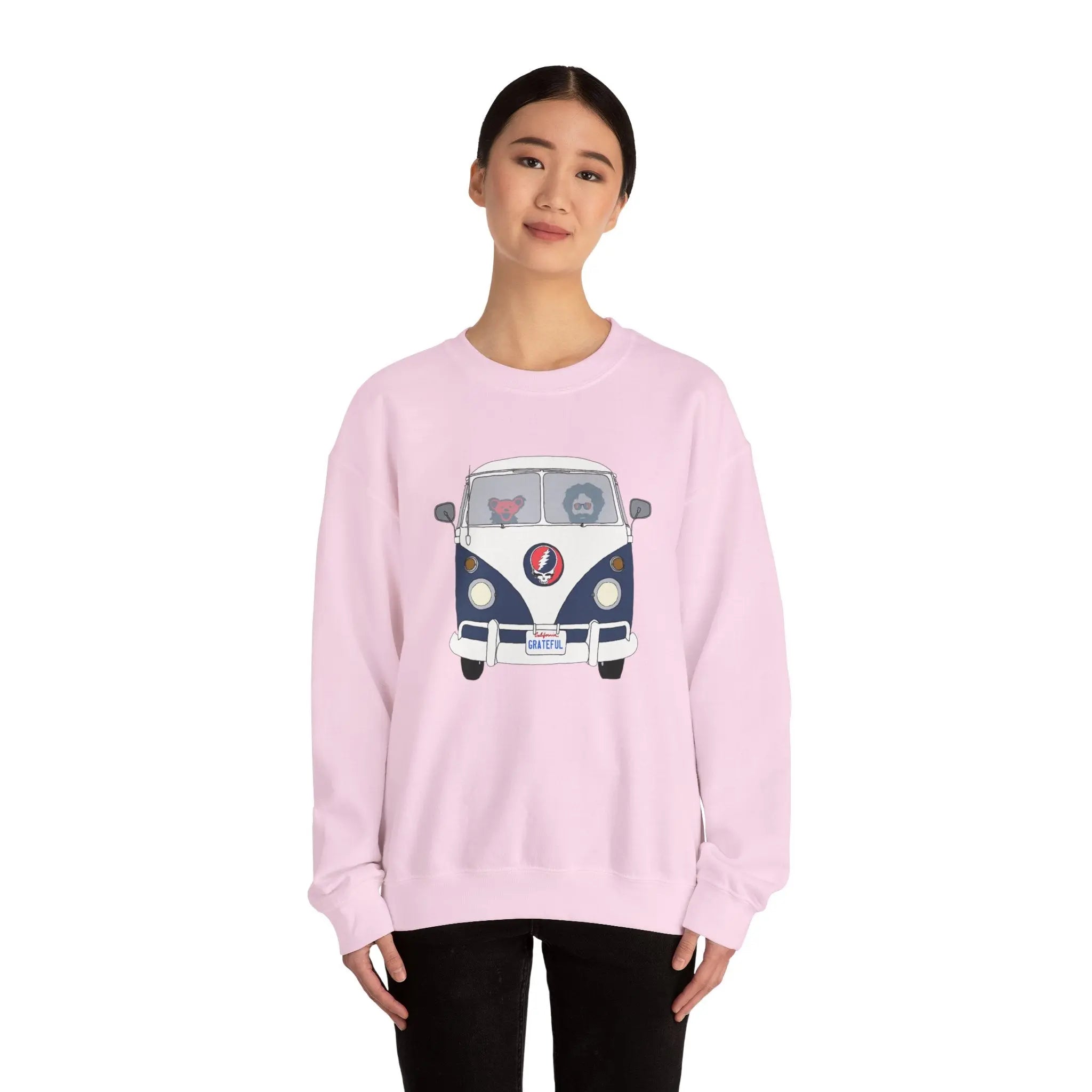 Light pink crewneck sweatshirt with blue bus graphic
