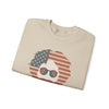 Sand crewneck sweatshirt with American flag face graphic and sunglasses, folded