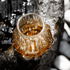 Japanese crystal whisky glass, inside view with amber whisky and sparkling bubbles