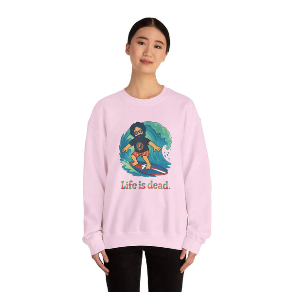 Light pink crewneck sweatshirt with surfing character graphic and Life is dead. text