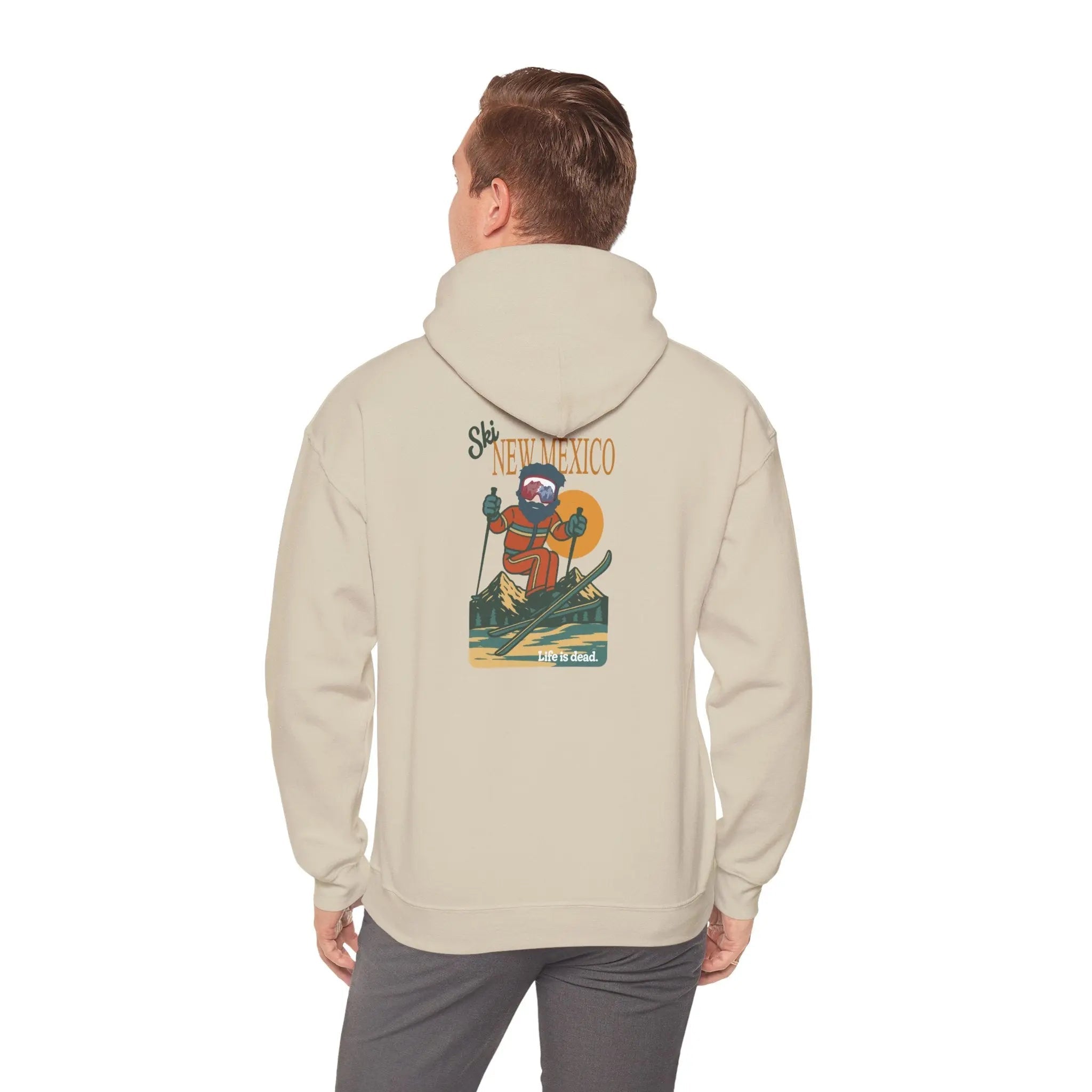 Light beige ski-themed hoodie with back graphic; hood and long sleeves