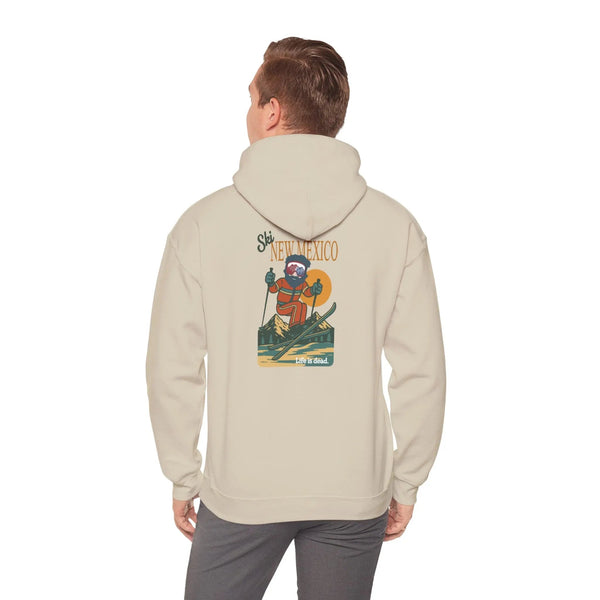 Light beige ski-themed hoodie with back graphic; hood and long sleeves