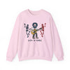 Light pink crewneck sweatshirt with front band graphic and text