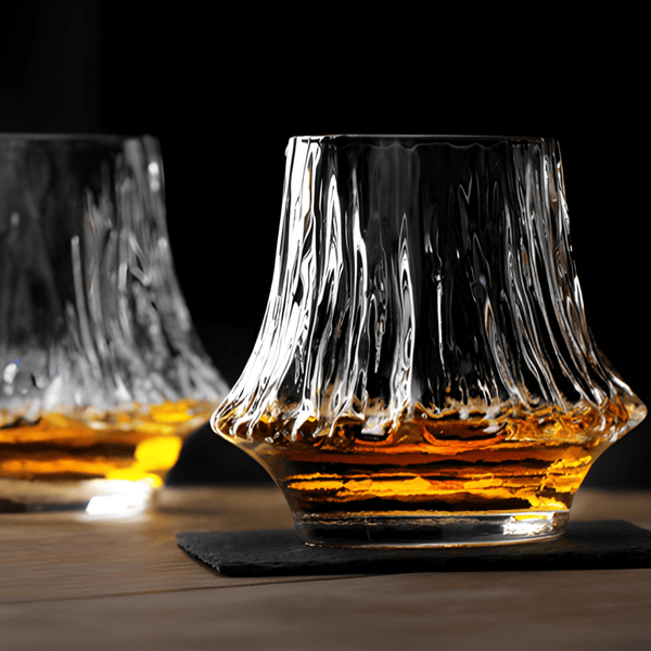 Faceted Japanese crystal whisky glass with amber liquid, thick fluted rim