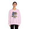 Unisex camping sweatshirt in light pink with illustrated camper, dog, and skull graphic