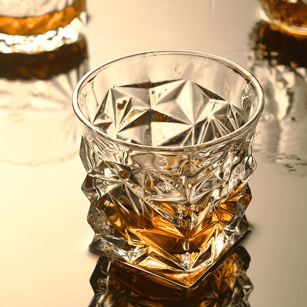 Faceted crystal whisky glass with geometric cut pattern