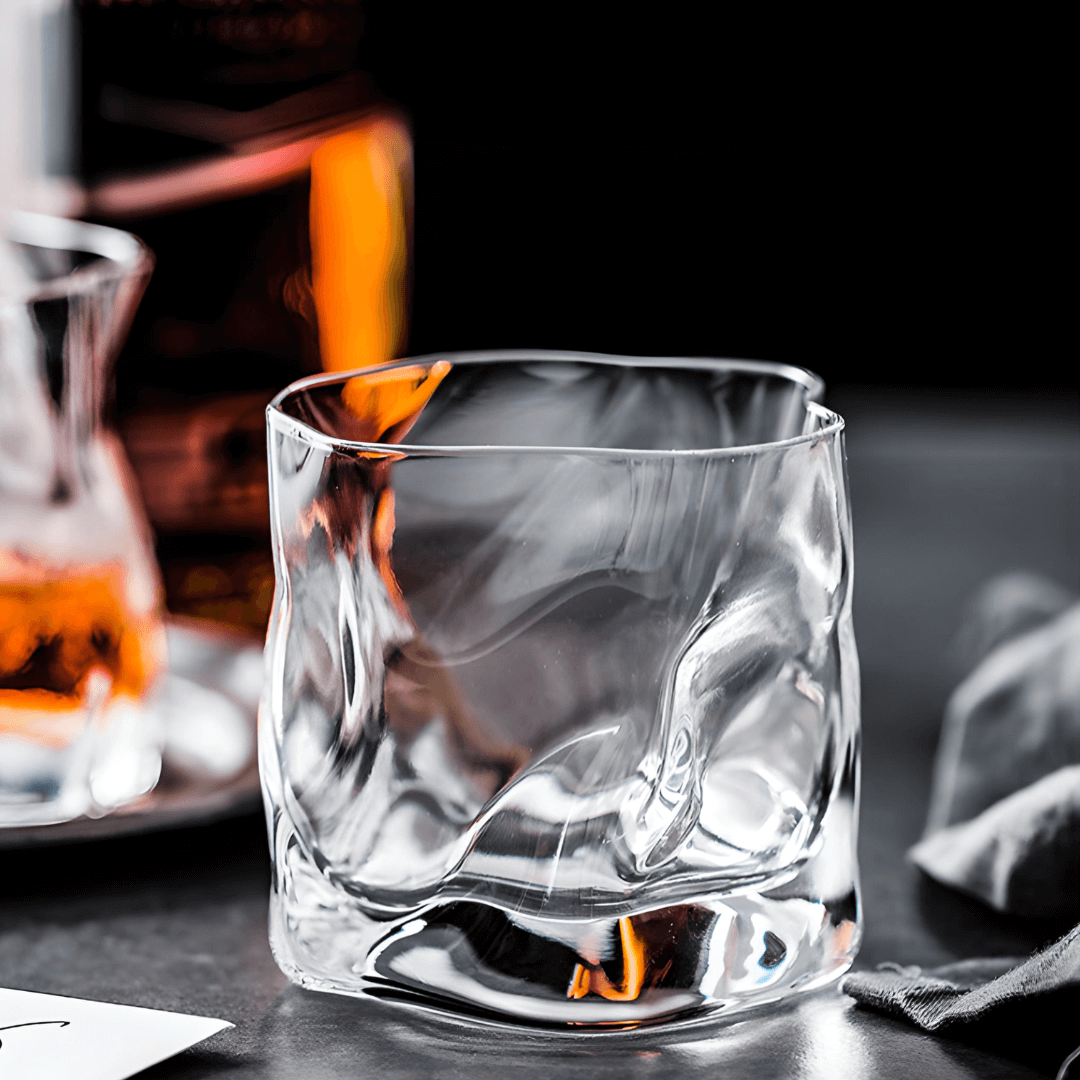 Hoshi Japanese crystal whisky glass with amber whisky, faceted sides and rounded rim