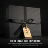 Wrapped gift box for whisky glasses with satin bow and hanging tag