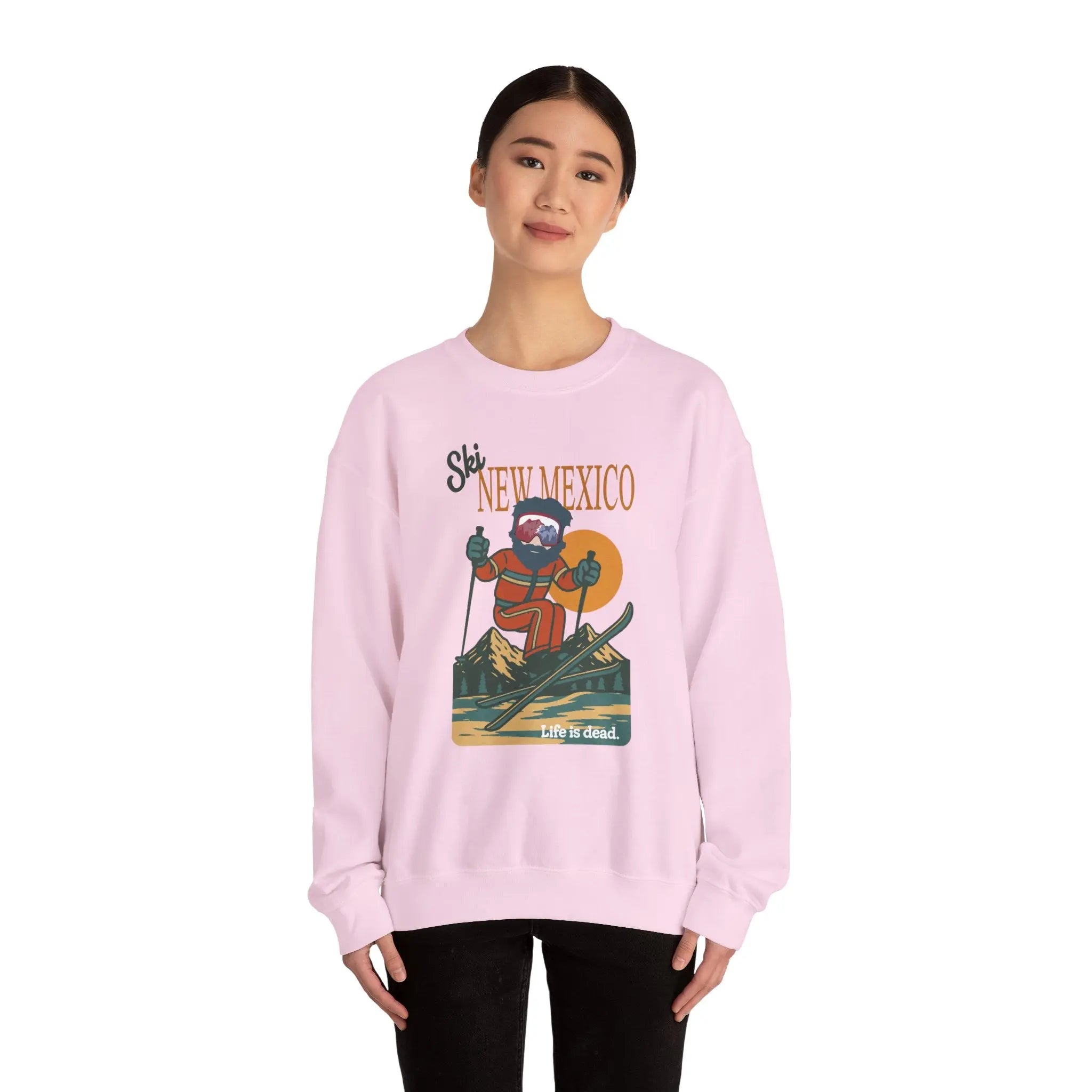 Light pink crewneck sweatshirt with front ski graphic and ribbed cuffs