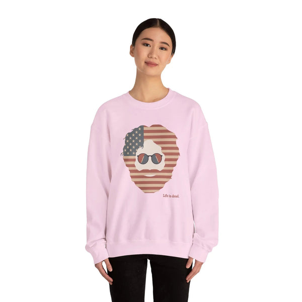 Light pink crewneck sweatshirt with American flag face graphic and sunglasses