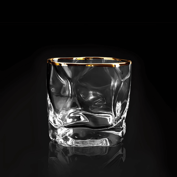 Gold Hoshi whisky glass, clear cut crystal with gold rim, empty and reflective