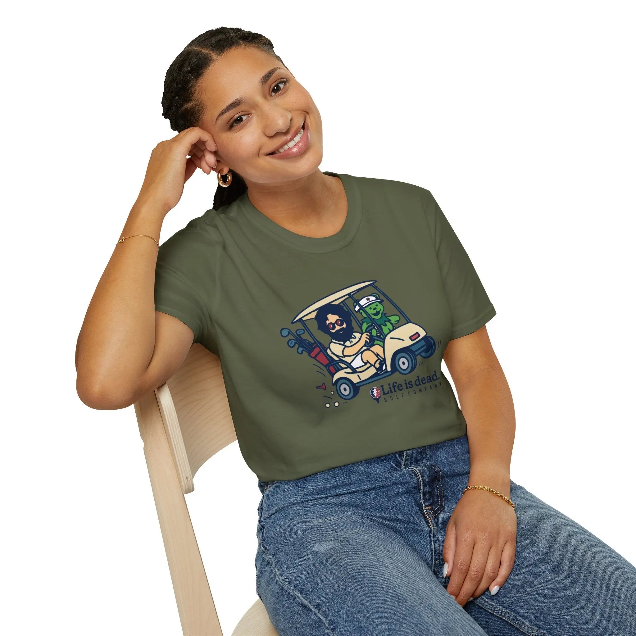 Olive green graphic T-shirt with cartoon truck and character logo-style front print