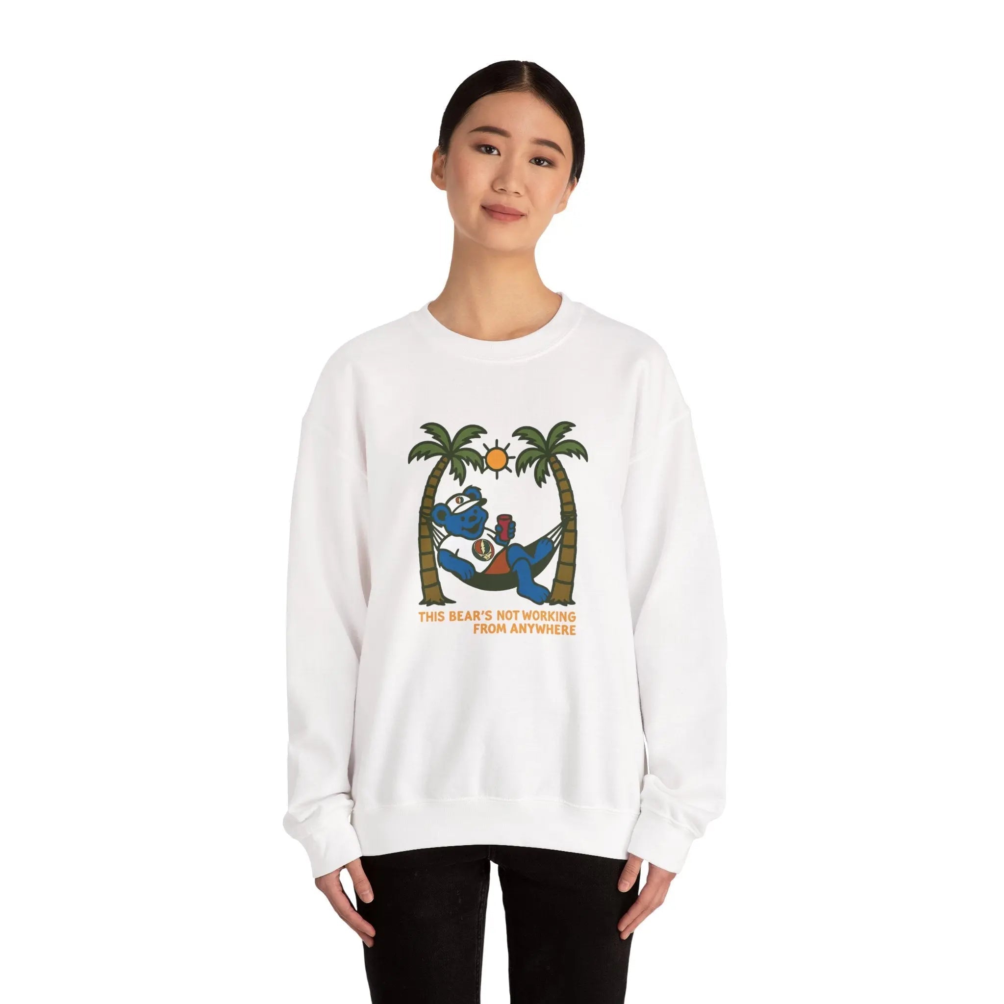 White crewneck sweatshirt on model, front bear-and-palm graphic