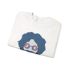 White folded crewneck sweatshirt with blue face graphic and sunglasses print