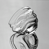 Crystal whisky glass with clear swirling facets, two stacked angles shown.