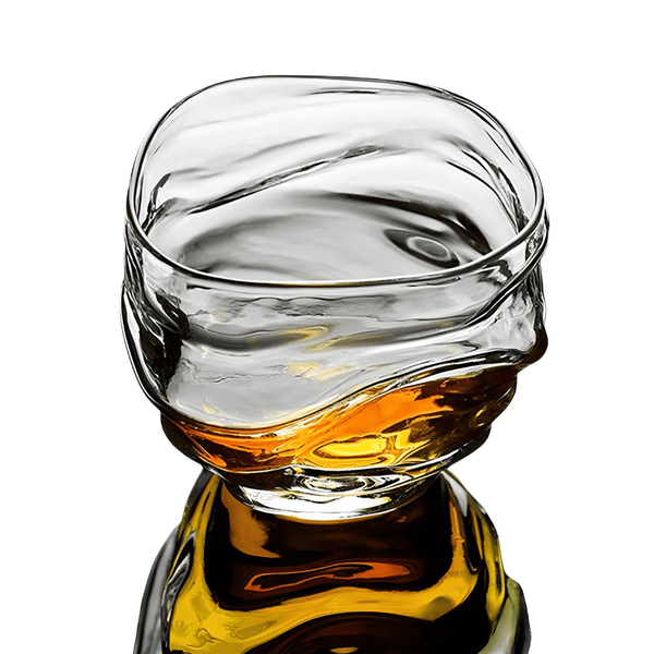 Crystal whisky glass close-up with amber liquid and clear glass rim