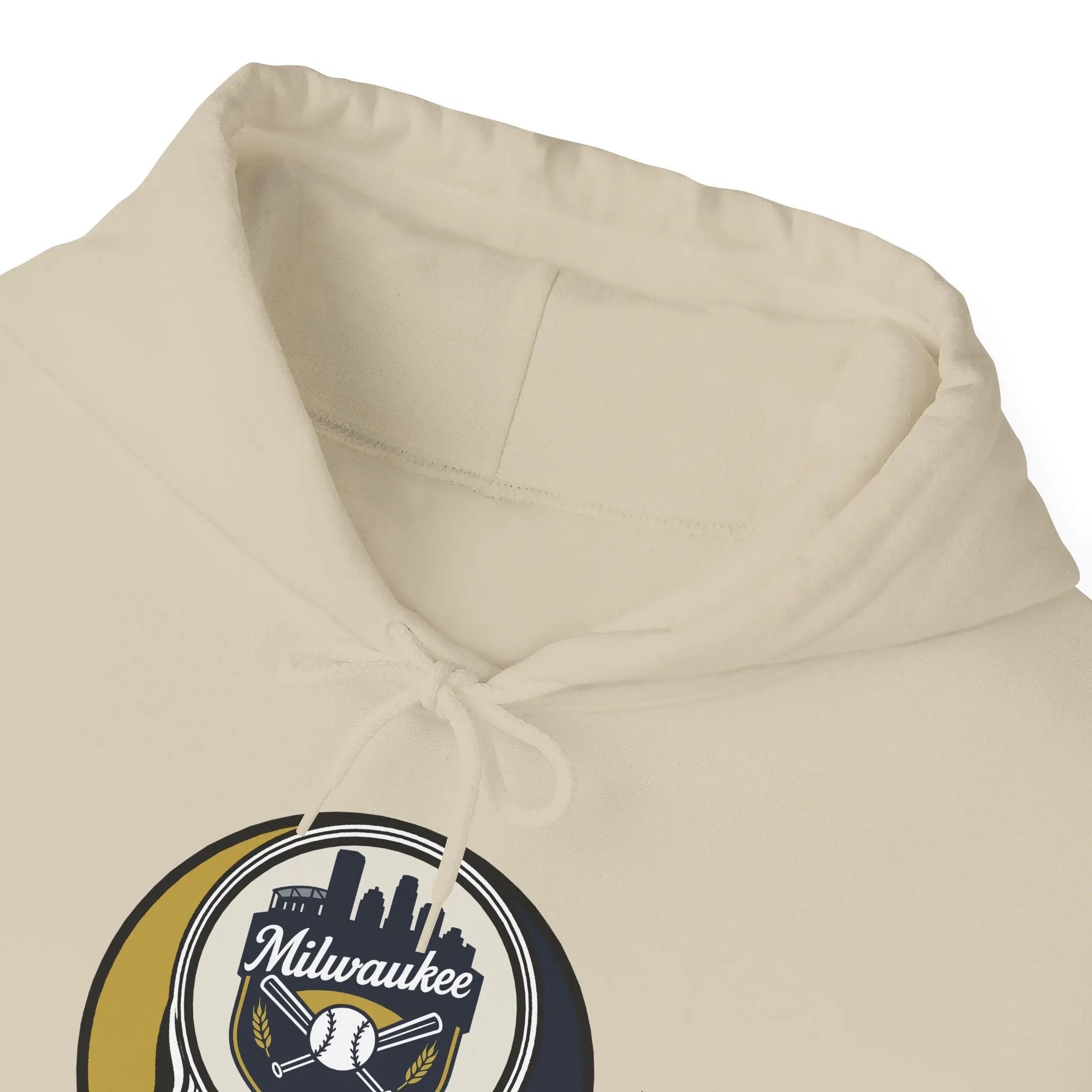 Cream hoodie close-up of drawstring hood and Milwaukee logo patch