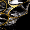 Close-up bottom view of Japanese crystal whisky glass with gold line accents