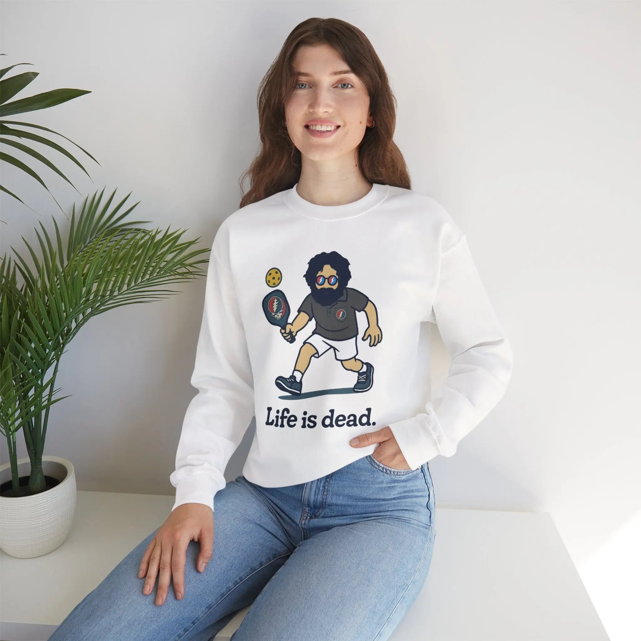 White crewneck sweatshirt with cartoon character graphic and 