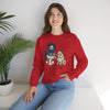 Red crewneck sweatshirt with front cartoon graphic; worn by a seated female model