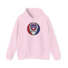Light pink hoodie with drawstring hood, front pocket, and TEXAS circular skull graphic