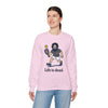 Light pink crewneck sweatshirt with cartoon character graphic and 'Life is dead,' modeled